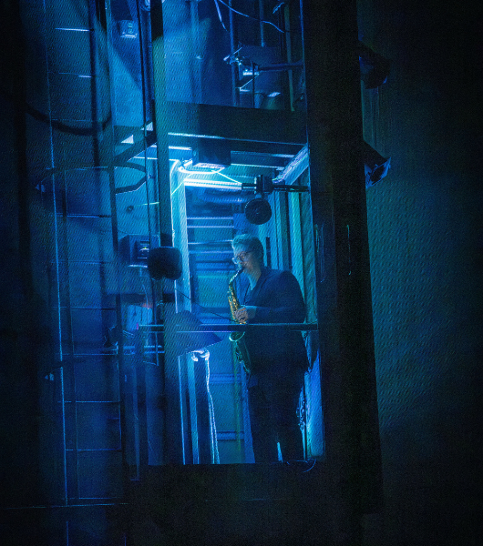 Saxophone player in blue lighting